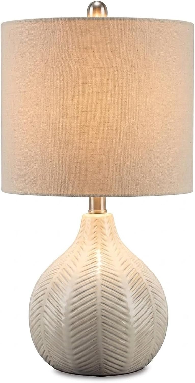 Signature Design by Ashley Rainermen Ceramic Table Lamp, 21″, Off White | Textured herringbone base, Transparent white glaze, Hardback fabric drum shade, Bedside use, 92.5-inch cord, E26 socket